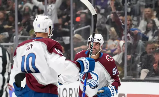 Colorado Avalanche center Nazem Kadri, right, celebrates his goal with center Nicolas Roy during the first period of Game 3 in the first round of the NHL hockey Stanley Cup playoffs against the Los Angeles Kings, Thursday, April 23, 2026, in Los Angeles. (AP Photo/Mark J. Terrill)