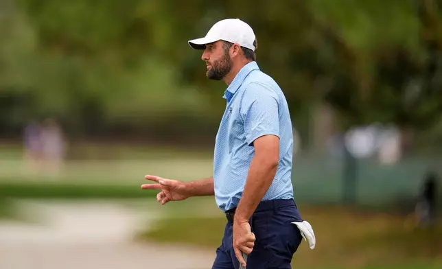 Scottie Scheffler celebrates his putt on the 16th hole during the final round of the RBC Heritage golf tournament Sunday, April 19, 2026, in Hilton Head, S.C. (AP Photo/Mike Stewart)