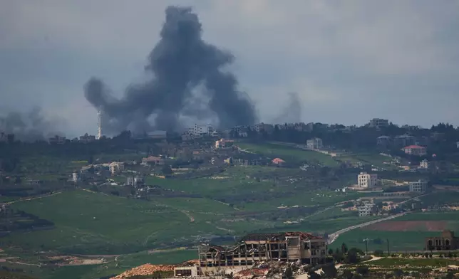 Smoke rises following an Israeli bombardment in southern Lebanon as seen from northern Israel, Sunday, April 12, 2026. (AP Photo/Ariel Schalit)