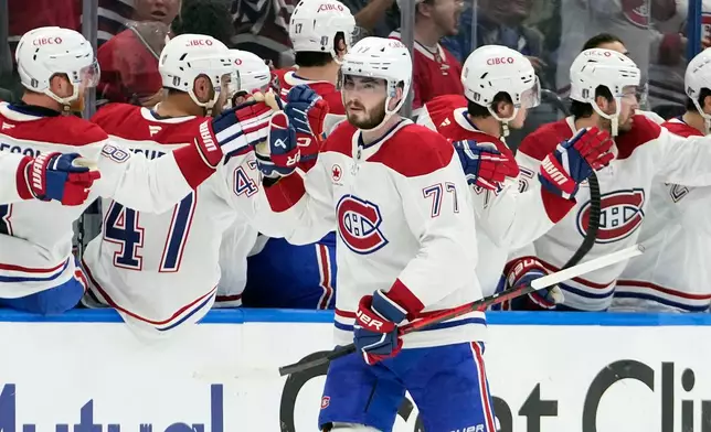 Montréal Canadiens center Kirby Dach (77) celebrates with the bench after his goal against the Tampa Bay Lightning during the second period in Game 5 of an NHL hockey Stanley Cup first-round playoff series, Wednesday, April 29, 2026, in Tampa, Fla. (AP Photo/Chris O'Meara)