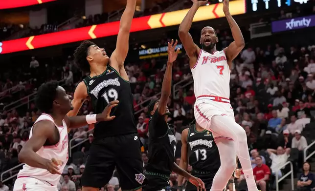 Houston Rockets forward Kevin Durant (7) goes up to the basket against Minnesota Timberwolves center Joan Beringer (19) during the first half of an NBA basketball game, Friday, April 10, 2026, in Houston. (AP Photo/ Karen Warren)