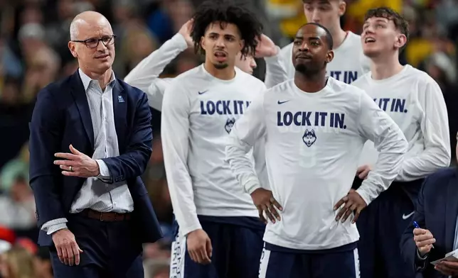 UConn head coach Dan Hurley, left, reacts during the second half of the NCAA college basketball tournament national championship game against Michigan at the Final Four, Monday, April 6, 2026, in Indianapolis. (AP Photo/Abbie Parr)