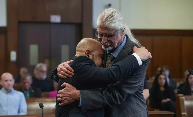 Harry Ruiz hugs his lawyer, Ron Kuby, after a judge in New York vacates his murder conviction on Monday, April 27, 2026. (Dean Moses/amNewYork via AP, Pool)