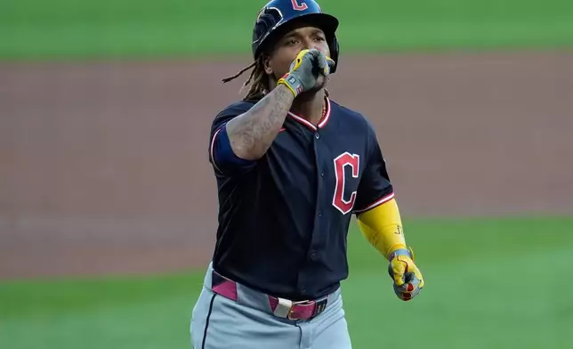 Cleveland Guardians' José Ramírez (11) celebrates his solo homerun in the first inning of a baseball game against the Atlanta Braves, Saturday, April 11, 2026, in Atlanta. (AP Photo/Mike Stewart)