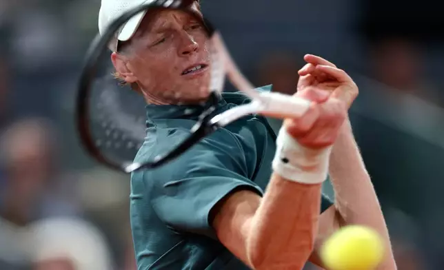 Jannik Sinner of Italy returns the ball to Rafael Jodar of Spain during the Madrid Open tennis tournament in Madrid, Wednesday, April 29, 2026. (AP Photo/Pablo Garcia)