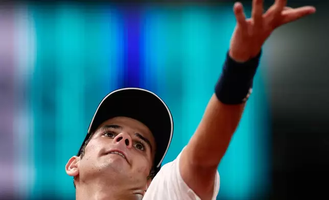 Rafael Jodar of Spain returns the ball to Jannik Sinner of Italy during the Madrid Open tennis tournament in Madrid, Wednesday, April 29, 2026. (AP Photo/Pablo Garcia)