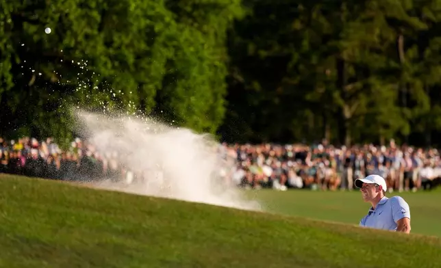 Rory McIlroy, of Northern Ireland, hits from the bunker on the 18th hole during the final round of the Masters golf tournament at the Augusta National Golf Club, Sunday, April 12, 2026, in Augusta, Ga. (AP Photo/Matt Slocum)