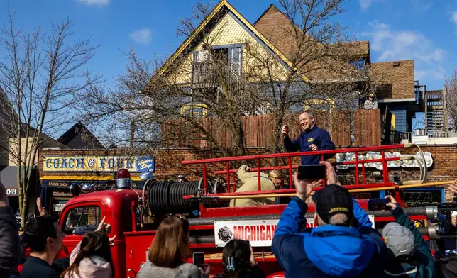 Michigan head coach Dusty May smiles during a parade celebrating their national championship win in the NCAA college basketball tournament , Saturday, April 11, 2026, in Ann Arbor, Mich. (Devin Anderson-Torrez/Ann Arbor News via AP)