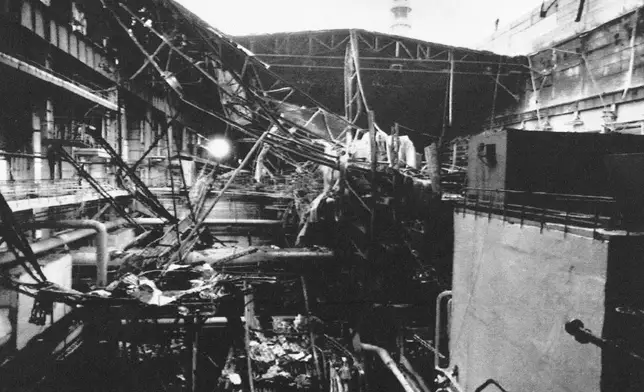 FILE - Remains of the collapsed roof at the Chernobyl nuclear plant, damaged in the separate 1991 fire in a turbine hall for Reactor No. 2, in Chernobyl, Ukraine, Oct. 13, 1991. (AP Photo/Efrem Lukatsky, File)