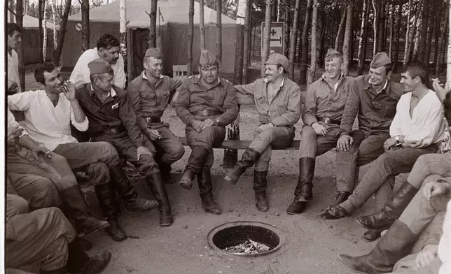 Soldiers taking part in cleanup operations following the Chernobyl power plant explosion rest in a tent camp inside the "exclusion zone" in the autumn of 1986, in Chernobyl, Ukraine. (AP Photo/Efrem Lukatsky)