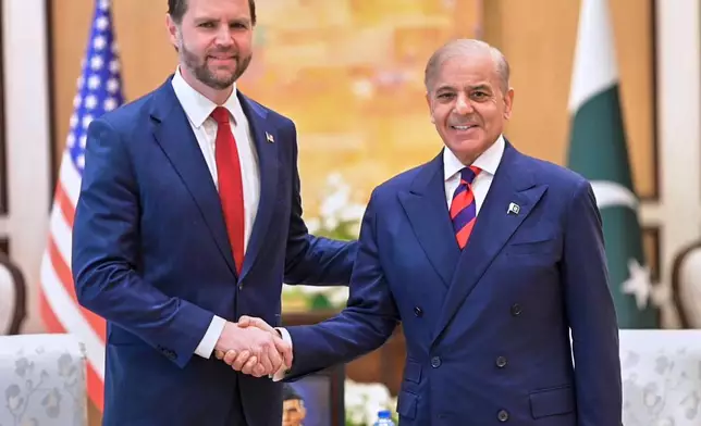 In this photo released by the Pakistan Prime Minister Office, U.S. Vice President JD Vance, left, shakes hand with Pakistani Prime Minister Shehbaz Sharif prior to their meeting, in Islamabad, Pakistan, Saturday, April 11, 2026 (Pakistan Prime Minister Office via AP)