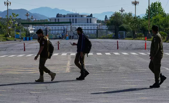 Police officers take position in Islamabad, Pakistan, to ensure security ahead of possible negotiations between Iran and the United States, Friday, April 10, 2026. (AP Photo/Anjum Naveed)