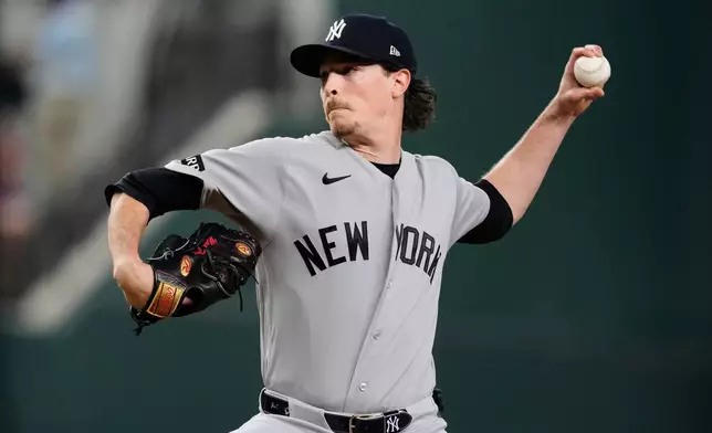 New York Yankees pitcher Max Fried throws to the Texas Rangers in the first inning of a baseball game Monday, April 27, 2026, in Arlington, Texas. (AP Photo/Tony Gutierrez)