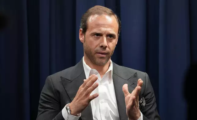 Davide Triacca, Sustainability Director for the Salvatore Ferragamo group, talks with journalist during an interview with Associated Press in Milan, Italy, Wednesday, April 22, 2026. (AP Photo/Antonio Calanni)