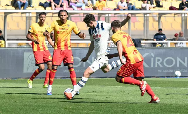 Atalanta's Giorgio Scalvini scores his side's opening goal during the Serie A soccer match between Lecce and Atalanta, in Lecce, Italy, Monday, April 6, 2026. (Pierluigi Pinto/LaPresse via AP)