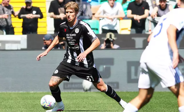 Udinese's Thomas Kristensen goes for the ball during the Serie A soccer match between Udinese and Como, in Udine, Italy, Monday, April 6, 2026. (Andrea Bressanutti/LaPresse via AP)