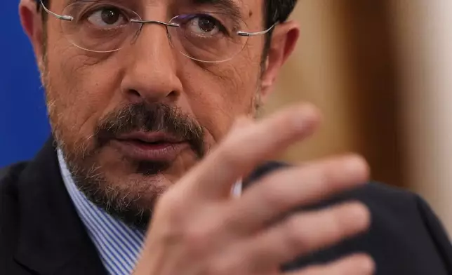 Cypriot President Nikos Christodoulides gestures as he speaks during an Associated Press interview ahead of this week's major EU-Middle East summit, at the presidential palace in the capital Nicosia, Cyprus, Tuesday, April 21, 2026. (AP Photo/Petros Karadjias)