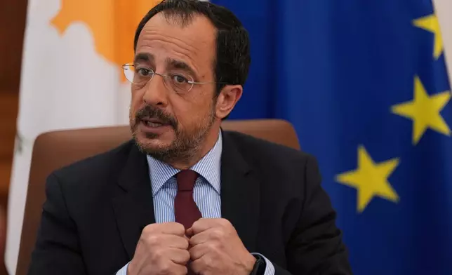 Cypriot President Nikos Christodoulides gestures as he speaks during an Associated Press interview ahead of this week's major EU-Middle East summit, at the presidential palace in the capital Nicosia, Cyprus, Tuesday, April 21, 2026. (AP Photo/Petros Karadjias)