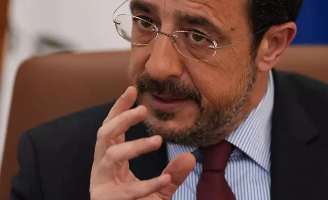 Cypriot President Nikos Christodoulides gestures as he speaks during an Associated Press interview ahead of this week's major EU-Middle East summit, at the presidential palace in the capital Nicosia, Cyprus, Tuesday, April 21, 2026. (AP Photo/Petros Karadjias)