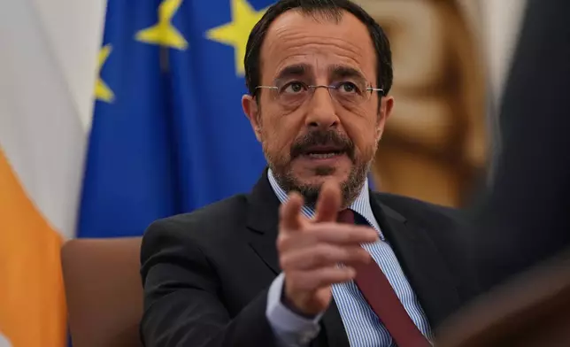 Cypriot President Nikos Christodoulides gestures as he speaks during an Associated Press interview ahead of this week's major EU-Middle East summit, at the presidential palace in the capital Nicosia, Cyprus, Tuesday, April 21, 2026. (AP Photo/Petros Karadjias)