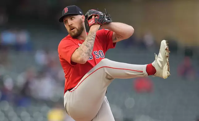 Boston Red Sox starting pitcher Garrett Crochet (35) winds up to deliver during the first inning of a baseball game against the Minnesota Twins Monday, April 13, 2026, in Minneapolis. (AP Photo/Abbie Parr)