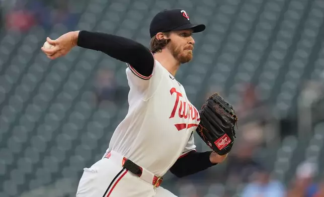 Minnesota Twins starting pitcher Bailey Ober (17) delivers during the first inning of a baseball game against the Boston Red Sox Monday, April 13, 2026, in Minneapolis. (AP Photo/Abbie Parr)