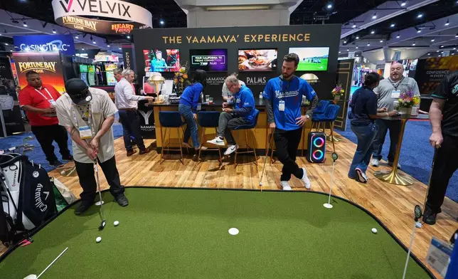 Convention attendees take part in a display from the Yaamava' Resort &amp; Casino at the Indian Gaming Association's annual convention in San Diego, Thursday, April 2, 2026. (AP Photo/Gregory Bull)