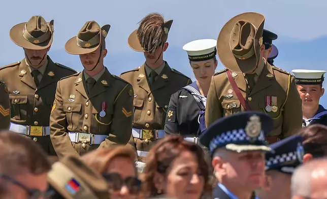 Australian and New Zealand soldiers pay their respects during a ceremony in recognition of the fallen during Gallipoli campaign, at the Cape Helles British memorial site in the Gallipoli peninsula near Canakkale, Turkey, Friday, April 24, 2026. (Sercan Ozkurnazli/Dia Photo via AP)