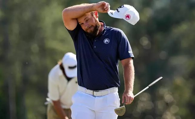 Tyrrell Hatton, of England, walks off the on the 18th hole after the final round of the Masters golf tournament at the Augusta National Golf Club, Sunday, April 12, 2026, in Augusta, Ga. (AP Photo/David J. Phillip)