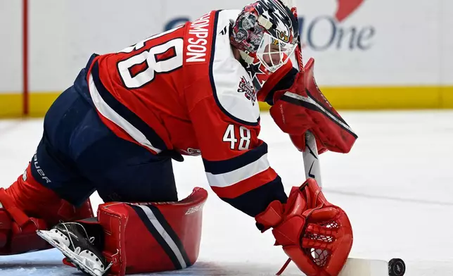 Washington Capitals goaltender Logan Thompson makes a save during the second period of an NHL Hockey game against the Buffalo Sabres, Saturday, April 4, 2026, in Washington. (AP Photo/John McDonnell)