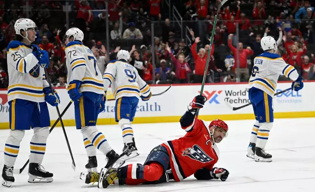 Washington Capitals left wing Alex Ovechkin celebrates Capitals Jakob Chychrun's goal during the first period of an NHL Hockey game against the Buffalo Sabres, Saturday, April 4, 2026, in Washington. (AP Photo/John McDonnell)