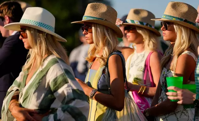 Patrons watch on the 17th hole during the third round of the Masters golf tournament at the Augusta National Golf Club, Saturday, April 11, 2026, in Augusta, Ga. (AP Photo/Gerald Herbert)