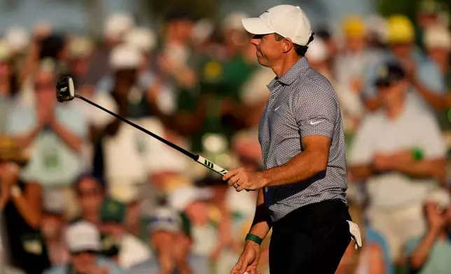 Rory McIlroy, of Northern Ireland, waves after his putt on the 18th hole during the third round of the Masters golf tournament at the Augusta National Golf Club, Saturday, April 11, 2026, in Augusta, Ga. (AP Photo/Matt Slocum)