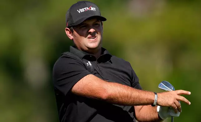 Patrick Reed watches his tee shot on the 12th hole during the second round of the Masters golf tournament at the Augusta National Golf Club, Friday, April 10, 2026, in Augusta, Ga. (AP Photo/Eric Gay)