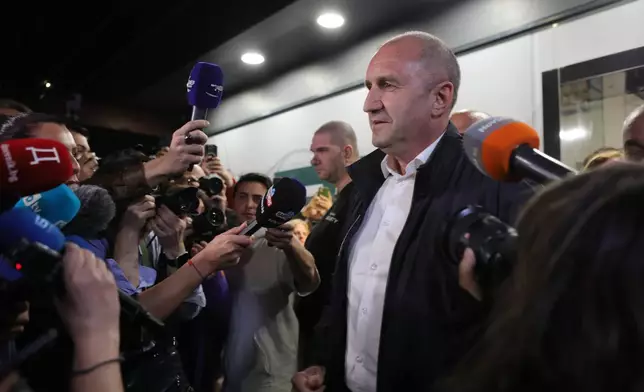 Former Bulgarian President Rumen Radev speaks to journalists after the polls closed in Sunday's election, in Sofia, Bulgaria, April 19, 2026. (AP Photo/Valentina Petrova)