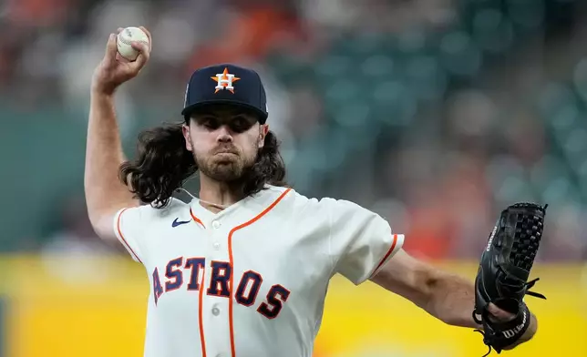 Houston Astros pitcher Spencer Arrighetti delivers during the first inning of a baseball game against the Colorado Rockies, Wednesday, April 15, 2026, in Houston. (AP Photo/Kevin M. Cox)