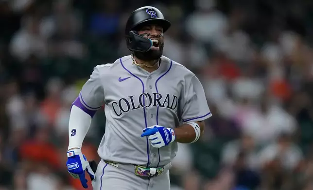 Colorado Rockies' Willi Castro reacts after being hit on the hand by a pitch during the fourth inning of a baseball game against the Houston Astros, Wednesday, April 15, 2026, in Houston. (AP Photo/Kevin M. Cox)