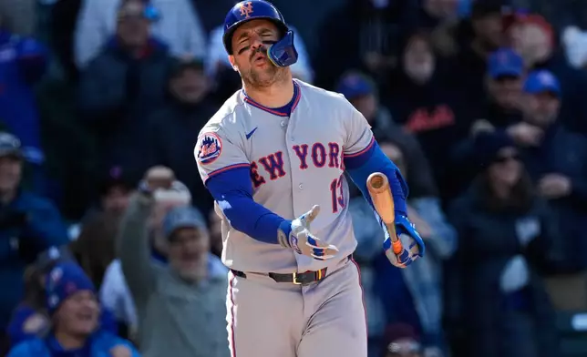 New York Mets' Luis Torrens reacts after striking out swinging during the 10th inning of a baseball game against the Chicago Cubs in Chicago, Sunday, April 19, 2026. (AP Photo/Nam Y. Huh)
