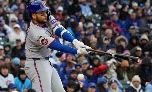 New York Mets' Bo Bichette strikes out swinging during the first inning of a baseball game against the Chicago Cubs in Chicago, Sunday, April 19, 2026. (AP Photo/Nam Y. Huh)