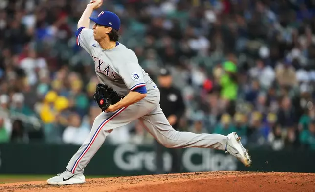 Texas Rangers starting pitcher Jacob deGrom throws during the third inning of a baseball game against the Seattle Mariners, Friday, April 17, 2026, in Seattle. (AP Photo/Lindsey Wasson)