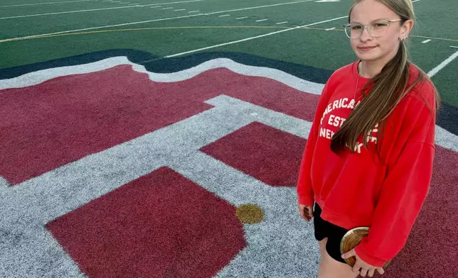 Becky Pepper-Jackson poses on the infield Tuesday, April 7, 2026, at Bridgeport High School in Bridgeport, W.VA. (AP Photo/John Raby)