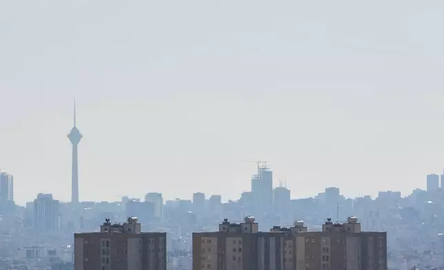 Milad telecommunication tower is seen at left in a general view of a part of Tehran, Iran, Thursday, April 23, 2026. (AP Photo/Vahid Salemi)