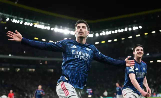 Arsenal's Kai Havertz celebrates after scoring his sides first goal during the Champions League quarterfinals, first leg, soccer match between Sporting CP and Arsenal, in Lisbon, Tuesday, April 7, 2026. (AP Photo/Armando Franca)