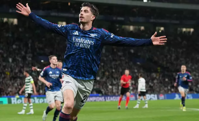Arsenal's Kai Havertz celebrates after scoring his sides first goal during the Champions League quarterfinals, first leg, soccer match between Sporting CP and Arsenal, in Lisbon, Tuesday, April 7, 2026. (AP Photo/Armando Franca)