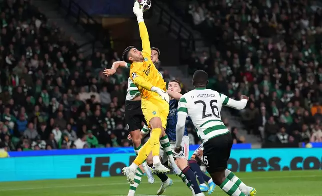 Sporting's goalkeeper Rui Silva makes a save during the Champions League quarterfinals, first leg, soccer match between Sporting CP and Arsenal, in Lisbon, Tuesday, April 7, 2026. (AP Photo/Armando Franca)