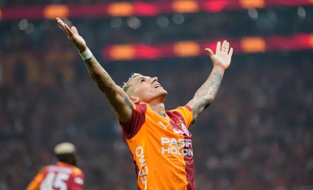 Galatasaray's Lucas Torreira celebrates after scoring his side's third goal during a Turkish Super Lig soccer match between Galatasaray and Fenerbahce in Istanbul, Turkey, Sunday, April 26, 2026. (AP Photo/Khalil Hamra)