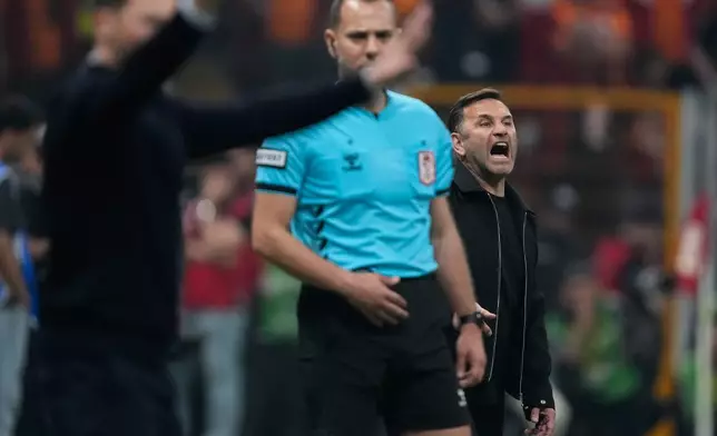 Galatasaray's head coach Okan Buruk gives instructions during a Turkish Super Lig soccer match between Galatasaray and Fenerbahce in Istanbul, Turkey, Sunday, April 26, 2026. (AP Photo/Emrah Gurel)