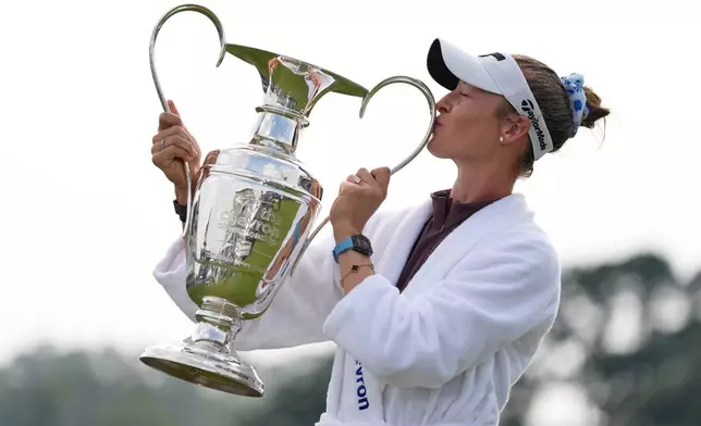 Nelly Korda poses with the trophy after winning the Chevron Championship LPGA golf tournament Sunday, April 26, 2026, in Houston. (AP Photo/Ashley Landis)