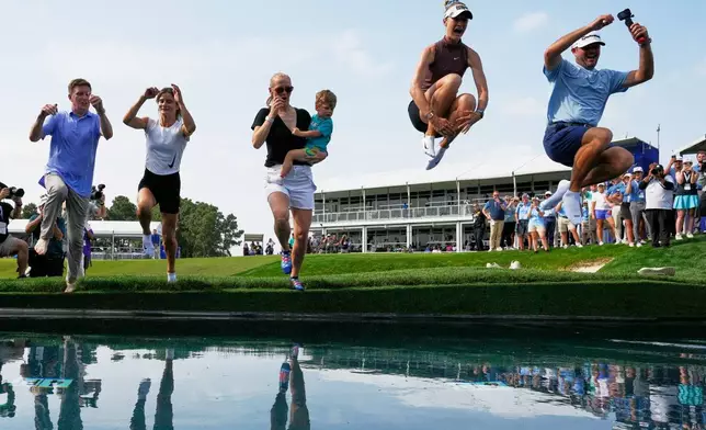 Nelly Korda celebrates by jumping in the water after winning the Chevron Championship LPGA golf tournament Sunday, April 26, 2026, in Houston. (AP Photo/David J. Phillip)