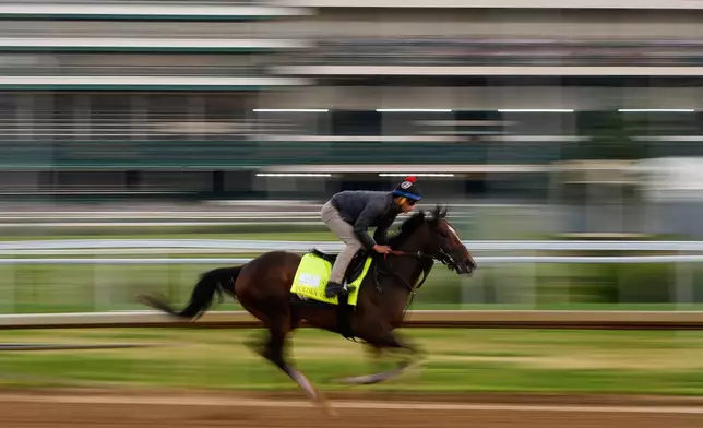 Kentucky Derby entrant Golden Tempo works out at Churchill Downs Monday, April 27, 2026, in Louisville, Ky. (AP Photo/Charlie Riedel)